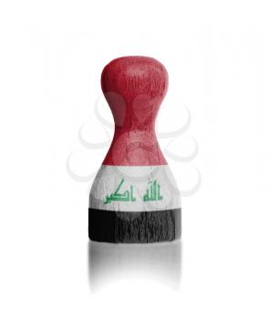 Wooden pawn with a painting of a flag, Iraq