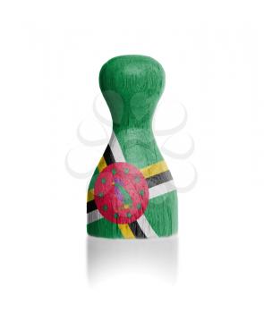 Wooden pawn with a painting of a flag, Dominica