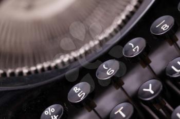 Close up photo of antique typewriter keys, shallow focus, natural colors