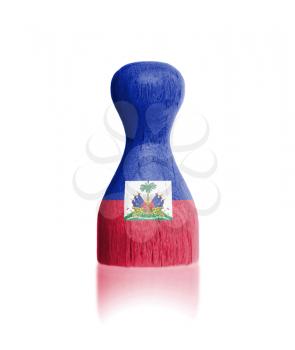 Wooden pawn with a painting of a flag, Haiti