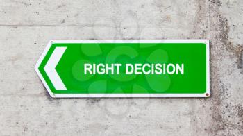 Green sign on a concrete wall - Right decision