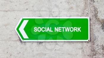 Green sign on a concrete wall - Social network