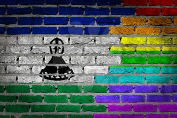 Dark brick wall texture - coutry flag and rainbow flag painted on wall - Lesotho