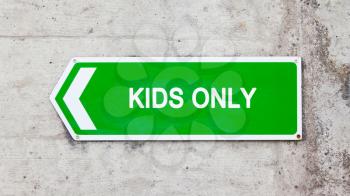 Green sign on a concrete wall - Kids only