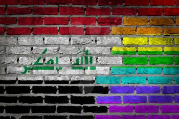 Dark brick wall texture - coutry flag and rainbow flag painted on wall - Iraq