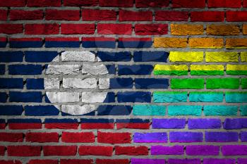 Dark brick wall texture - coutry flag and rainbow flag painted on wall - Laos