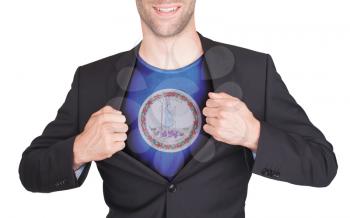 Businessman opening suit to reveal shirt with state flag (USA), Virginia