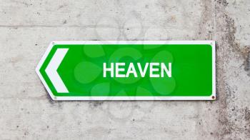 Green sign on a concrete wall - Heaven