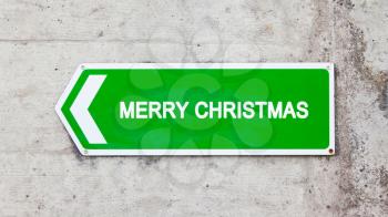 Green sign on a concrete wall - Merry christmas