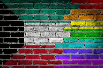 Dark brick wall texture - coutry flag and rainbow flag painted on wall - Kuwait