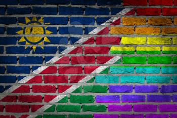 Dark brick wall texture - coutry flag and rainbow flag painted on wall - Namibia
