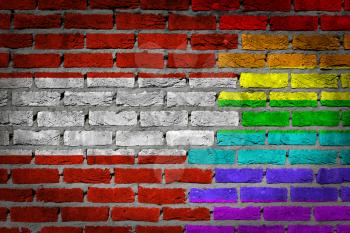 Dark brick wall texture - coutry flag and rainbow flag painted on wall - Austria
