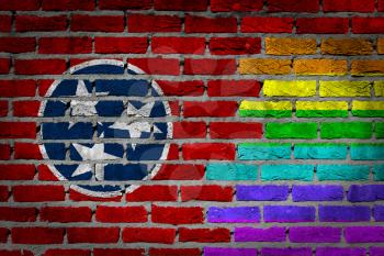 Dark brick wall texture - coutry flag and rainbow flag painted on wall - Tennessee