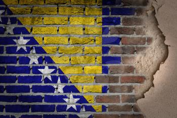 Dark brick wall texture with plaster - flag painted on wall - Bosnia and Herzegovina