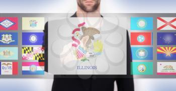 Hand pushing on a touch screen interface, choosing a state, Illinois