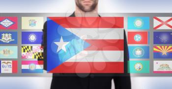 Hand pushing on a touch screen interface, choosing a state, Puerto Rico