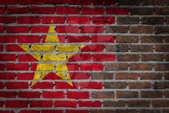 Dark brick wall texture - flag painted on wall - Vietnam