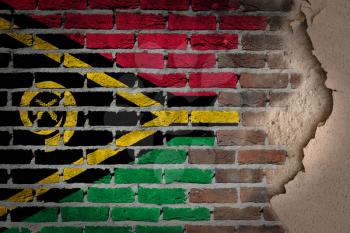 Dark brick wall texture with plaster - flag painted on wall - Vanuatu