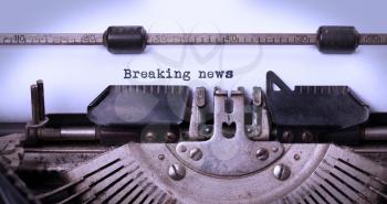 Vintage inscription made by old typewriter, breaking news