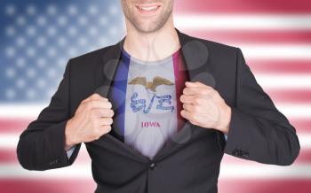 Businessman opening suit to reveal shirt with state flag (USA), Iowa