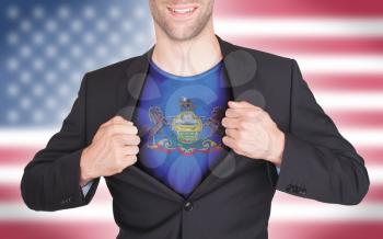 Businessman opening suit to reveal shirt with state flag (USA), Pennsylvania