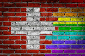 Dark brick wall texture - coutry flag and rainbow flag painted on wall - Switzerland