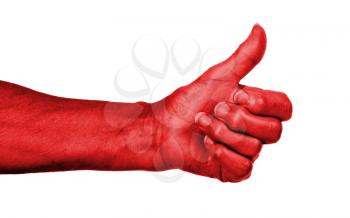 Old woman with arthritis giving the thumbs up sign, red skin