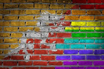 Dark brick wall texture - coutry flag and rainbow flag painted on wall - Bhutan