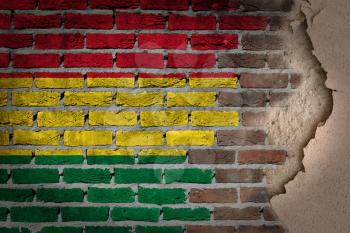 Dark brick wall texture with plaster - flag painted on wall - Bolivia