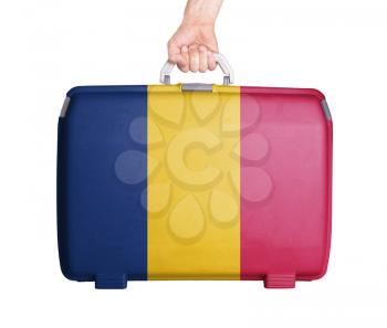 Used plastic suitcase with stains and scratches, printed with flag, Romania