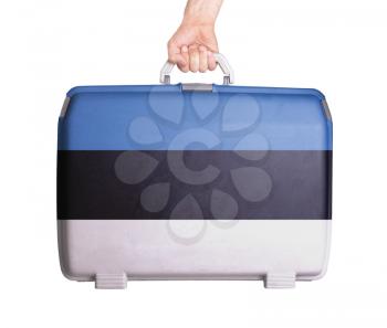 Used plastic suitcase with stains and scratches, printed with flag, Estonia
