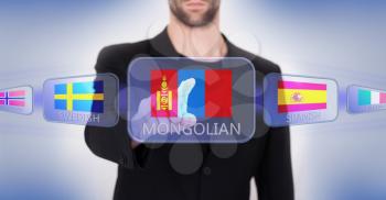 Hand pushing on a touch screen interface, choosing language or country, Mongolia