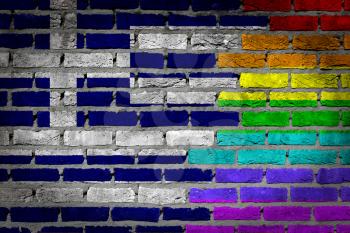 Dark brick wall texture - coutry flag and rainbow flag painted on wall - Greece