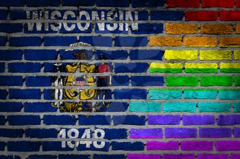 Dark brick wall texture - coutry flag and rainbow flag painted on wall - Wisconsin