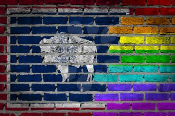 Dark brick wall texture - coutry flag and rainbow flag painted on wall - Wyoming