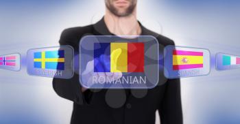 Hand pushing on a touch screen interface, choosing language or country, Romania