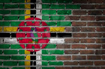 Very old dark red brick wall texture with flag - Dominica