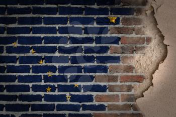 Dark brick wall texture with plaster - flag painted on wall - Alaska