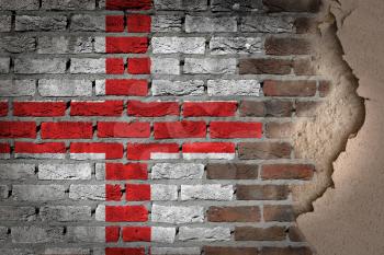 Dark brick wall texture with plaster - flag painted on wall - England