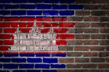 Very old dark red brick wall texture with flag - Cambodia