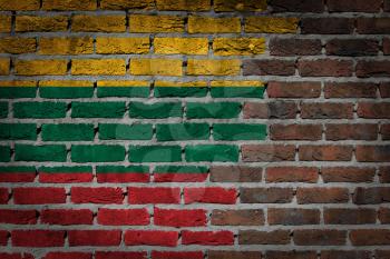 Very old dark red brick wall texture with flag - Lithuania