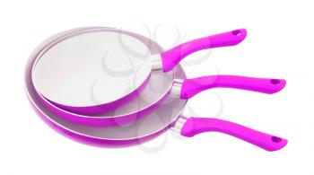 Set of three frying pans, isolated, close-up, pink
