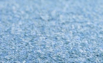 Carpet texture close-up, blue furry carpet texture background, selective focus