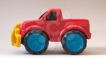 Simple plastic toy car isolated on white