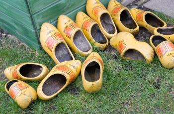 Pile of Dutch clog/Wooden Shoes outside in the rain