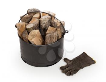 Metal basket of firewood, isolated on white