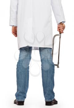 Crazy doctor is holding a big saw in his hands, isolated on white