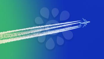 Large aircraft flying in sky, 4 stripes in the sky - Bright blue and green sky