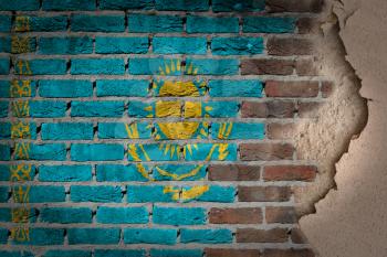 Dark brick wall texture with plaster - flag painted on wall - Kazakhstan