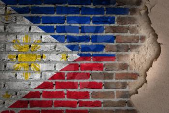 Dark brick wall texture with plaster - flag painted on wall - Phillipines